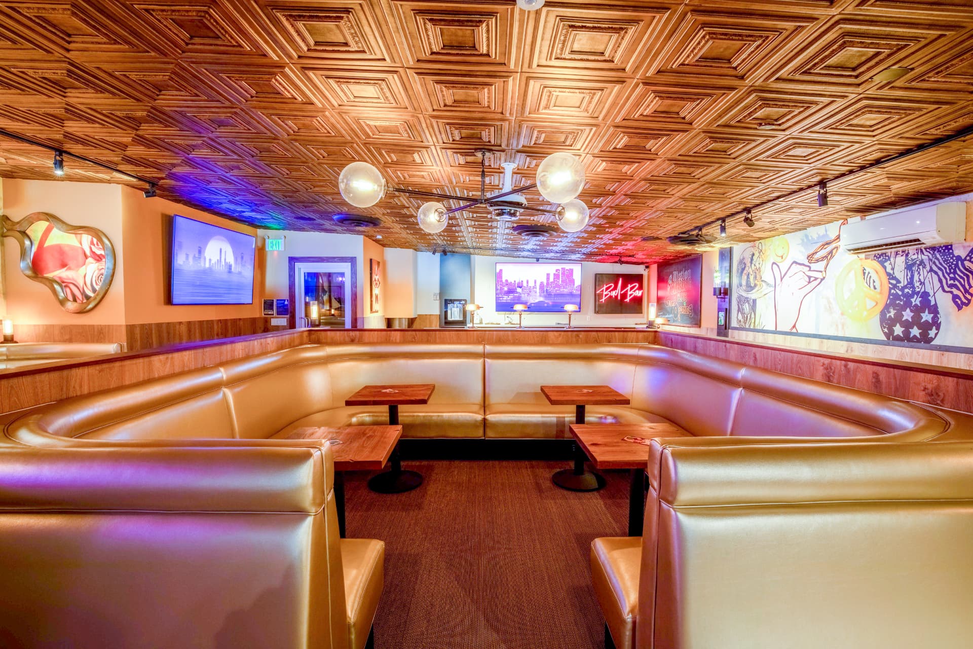 The lounge at Mission Cannabis Club with booth seating and warm lighting
